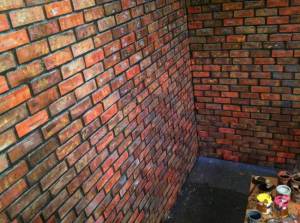 A brick wall painted by Akiko Nishijima Rotch. Courtesy image.