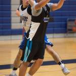 Brady Carandang, right, passes away from teammate Josh McAndrews during Thunder Mountain High School boys basketball practice at TMHS on Thursday, Dec. 7, 2017. (Michael Penn | Juneau Empire)