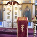 Father Steven McGuigan exits from behind the iconostasis at St. Nicholas Russian Orthodox Church on Friday. (Kevin Gullufsen | Juneau Empire)