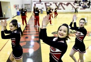 Juneau-Douglas High School cheerleaders and girls basketball team warm up for their opening game at the Capital City Classic at JDHS on Wednesday, Dec. 27, 2017. (Michael Penn | Juneau Empire)  Juneau-Douglas High School cheerleaders and girls basketball team warm up for their opening game at the Capital City Classic at JDHS on Wednesday, Dec. 27, 2017.