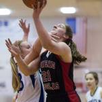 Juneau-Douglas&rsquo; Cassie Dzinich, right, is fouled by Sutherlin&rsquo;s Taylor Moser during their Capital City Classic Basketball Tournament game at JDHS on Thursday, Dec. 28, 2017. (Michael Penn | Juneau Empire)