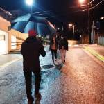 Ryan Cortes films Nancy Evelyn Barnes and Alayna Duncan as they walk down a downtown Juneau street. Image courtesy of Eriksen.