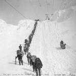 National Park Service, Klondike Gold Rush National Historical Library, Darcie Culbeck Collection, KLGO CS-50-10573. &ldquo;The Last Climb to the Summit of Chilkoot Pass,&rdquo; taken winter 1898. Photographer: Eric A. Hegg (207). In the center left is the northern end of the Golden Stairs between the False Summit and the True Summit and to the right of that is a single sled probably being hauled up to the Summit by the gasoline winch, part of Archie Burns&rsquo; surface tramway system. The gasoline-powered tramway was introduced by mid-April 1898. It was described as &ldquo;simply a pulley drum and gasoline engine at the summit of the pass, and enough rope to reach the bottom. Sleds were hitched onto the rope, which was wound around the drum and it pulled them to the top.&rdquo;