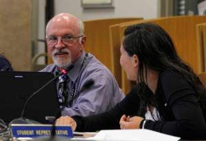 Juneau School District Superintendent Mark Miller smiles at Student Representative Dessa Gerger, a junior at Juneau-Douglas High School, at an Aug. 8, 2017 Board of Education meeting. (Alex McCarthy | Juneau Empire)
