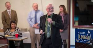 Dr. Mark Miller, superintendent for the Juneau School District, gives an overview of the district&rsquo;s budget at the Juneau Chamber of Commerce&rsquo;s weekly luncheon at the Moose Lodge on Thursday, Jan. 11, 2018. Appearing with Miller are Brian Holst, school board president, left, Ted Wilson, Director of Teaching and Learning, center, and Bridget Weiss, Director of Student Services, right. (Michael Penn | Juneau Empire)