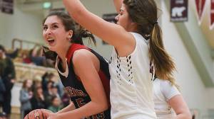 Juneau-Douglas High School freshman Janae Pusich looks for the hoop as Kayhi&rsquo;s Brittany Slick defends on Friday in Ketchikan. The Crimson Bears lost to the Kayhi Kings 75-62 on Friday and 46-31 on Saturday. (Hall Anderson | Ketchikan Daily News)
