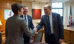 Rep. Ivy Spohnholz, D-Anchorage, left, and Rep. Chuck Kopp, R-Anchorage, deliver a message to Gov. Bill Walker that the House is open for business on Tuesday, Jan. 16, 2018. Legislators returned to Alaska&rsquo;s Capitol to open the Second Session of the 30th Legislature on Tuesday. (Michael Penn | Juneau Empire)