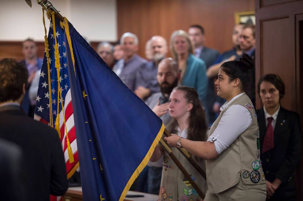 Girl Scouts Amara Sanguni, right, and Devin Moorehead bring in the state and national flags as legislators return to Alaska&rsquo;s Capitol to open the Second Session of the 30th Legislature on Tuesday, Jan. 16, 2018. (Michael Penn | Juneau Empire)