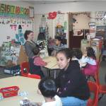 Tlingit language students Andria (Skaflestad) Hancock and Amy Wright teach kindergarteners in 2001-2002. Photo by Vivian Faith Prescott