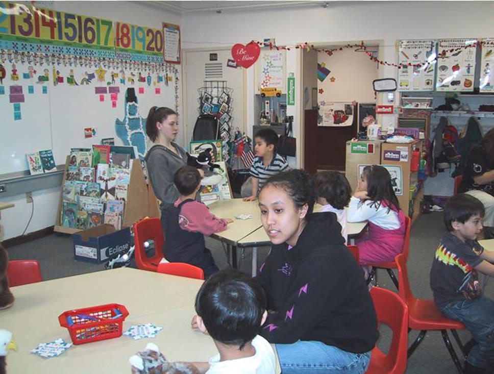 Tlingit language students Andria (Skaflestad) Hancock and Amy Wright teach kindergarteners in 2001-2002. Photo by Vivian Faith Prescott