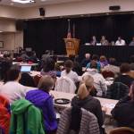 Listeners watch the stage during the inaugural Native Issues Forum of 2018 on Thursday, Jan. 18, 2018 in the Elizabeth Peratrovich Hall. Participating in the forum were Public Safety Commissioner Walt Monegan, Attorney General Jahna Lindemuth, and Central Council Tlingit and Haida Indian Tribes of Alaska Public Safety Manager Jason Wilson.(James Brooks | Juneau Empire)