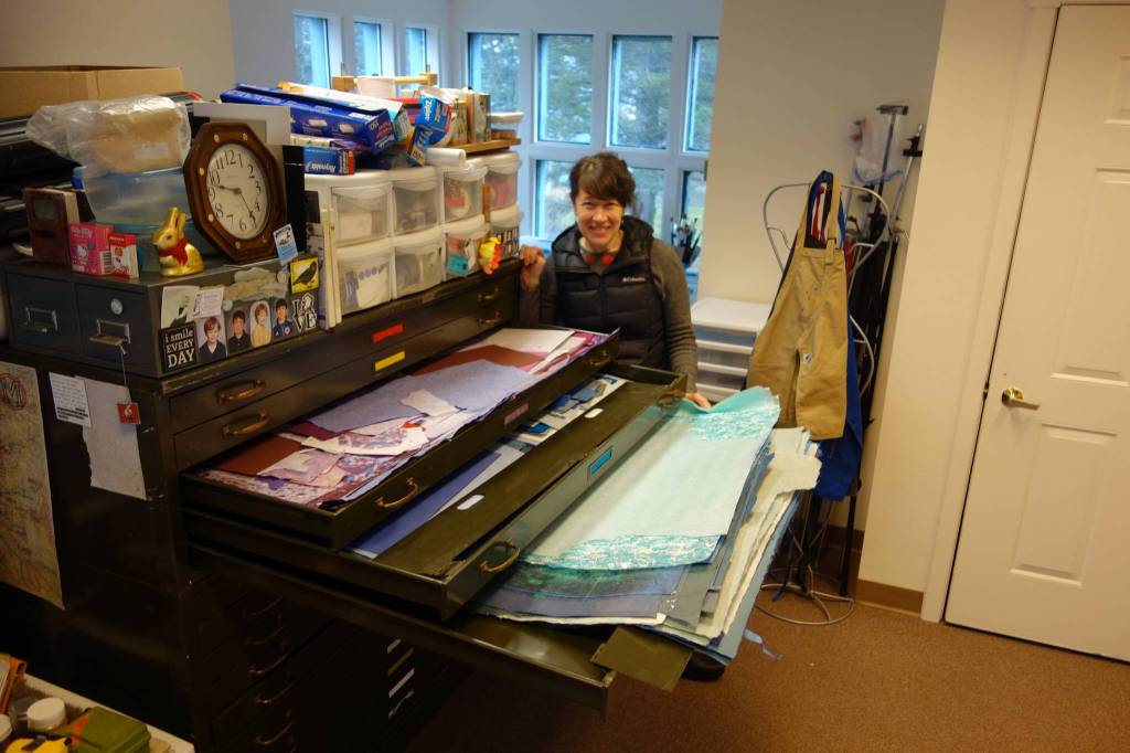 Sherri McDonald poses by her crafting paper at Color Wheel Arts. Clara Miller | Capital City Weekly