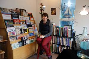 Sherri McDonald sits in her room of inspiration at Color Wheel Arts. Clara Miller | Capital City Weekly