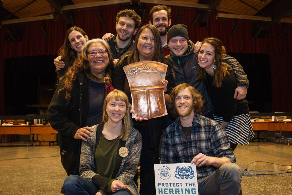 The Herring Rock Water Protectors pose with the Kaxhatjaa Tinaa or Herring Copper Shield that became &lsquo;at.oow&rsquo; for the Kik.sadi during the koo.eex&rsquo;. &lsquo;At.oow&rsquo; translates to &lsquo;owned or purchased object&rsquo;, the shield is now the property of the clan and will be brought out at future koo.eex&rsquo; to reaffirm the clan&rsquo;s special relationship to herring. Photo by Bethany Goodrich