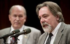 Randall Hoffbeck, Commissioner for the Department of Revenue, right, give their Spring Revenue Forecast with Gov. Bill Walker during a press conference at the Capitol on March 21, 2016. (Michael Penn | Juneau Empire File)