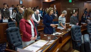 Senators take a moment of silence at the Capitol on Monday, Jan, 29, 2018, in memory of three Alaskan servicemen killed in action. The senate voted in favor of Senate Concurrent Resolution 14 to award the Alaska Decoration of Honor to David T. Brabander, Hansen B. Kirkpatrick and Jacob M. Sims. (Michael Penn | Juneau Empire)