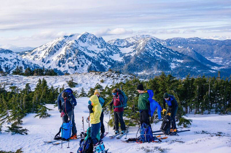 Putting on extra layers to stay warm in the mountain top winds. (Photo by Gabe Donohoe)