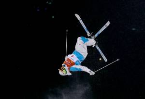 Yulia Galysheva, of Kazakhstan, jumps during the women&rsquo;s moguls finals at Phoenix Snow Park at the 2018 Winter Olympics in Pyeongchang, South Korea, Sunday, Feb. 11, 2018. (Gregory Bull | The Associated Press)