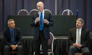 Mayo Schmidt, President and CEO of Hydro One Limited, center, gives an overview of the Ontario-based electric utility as Scott Morris, Avista Chairman, President and CEO, left, and Dennis Vermillion, Senior Vice President of Avista Corp. and President of Avista Utilities, listen during a public meeting with leadership from Hydro One, Avista and AEL&P at the Juneau Arts and Culture Center on Thursday, Jan. 18, 2018. (Michael Penn | Juneau Empire)