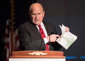 Gov. Bill Walker gives his opening remarks and shows off his granddaughters artwork at the 2018 Governor&rsquo;s Arts & Humanities Awards at the Juneau Arts & Culture Center on Thursday, Feb. 8, 2018. (Michael Penn | Juneau Empire)