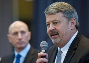 Mayo Schmidt, President and CEO of Hydro One Limited, left, listens to Dennis Vermillion, Senior Vice President of Avista Corp. and President of Avista Utilities, during a public meeting with leadership from AEL&P, Avista and Hydro One at the Juneau Arts and Culture Center on Thursday, Jan. 18, 2018. (Michael Penn | Juneau Empire)