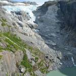 On Dec. 30, 2016, a rock face detached from the mountainside next to this unnamed glacier, crashing into the lake below and causing a 30-foot tall &ldquo;alpine tsunami&rdquo; to scour Cowee Creek channel. Researchers were noticed the rare event because of ongoing research in the H&