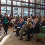 Alaska Native Sisterhood President Kevin Allen, left, escorts Keynote speaker Joaqlin Estus to the podium during the Elizabeth Peratrovich Day Celebration at the University of Alaska Southeast on Friday, Feb. 16, 2018. (Michael Penn | Juneau Empire)