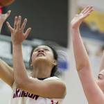 Juneau-Douglas&rsquo; Alyxn Bohulano, left, shoots against Ketchikan&rsquo;s Ashley Huffine at JDHS on Friday, Feb. 16, 2018. (Michael Penn | Juneau Empire)