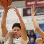 Thunder Mountain&rsquo;s Steven Rosales is pressured by Mt. Edgecumbe&rsquo;s Emmett Dunaway, left, and Bear Brown at TMHS on Friday, Feb. 16, 2018. (Michael Penn | Juneau Empire)