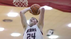 Juneau-Douglas High School senior Erik Kelly goes up for a dunk against Thunder Mountain at JDHS on Friday, Feb. 2. Kelly surpassed 1,000 career points in a JDHS uniform the following night against TMHS. (Michael Penn | Juneau Empire File)