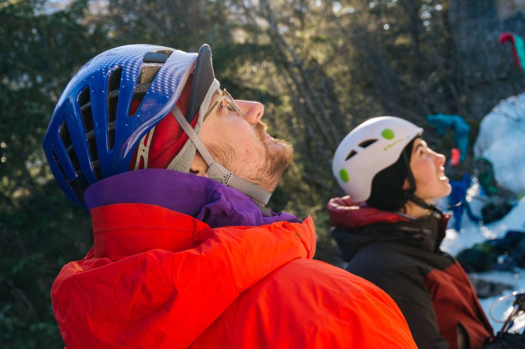 Students; Steven, and Mariah watch climber finishing route. (Photo by Gabe Donohoe)