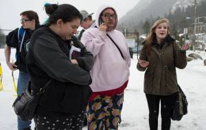 Kiana Christopherson, a senior at Yaakoosge Daakahidi Alternative High School, right, complains on Thursday, Feb. 22, 2018, about the school&rsquo;s lack of support for students holding a 17 minute vigil to honor the students gunned down Wednesday at Marjory Stoneman Douglas High School in Parkland, Florida. With Christopherson are senior Nathaniel Hensley-Williams, second from right, junior Nick Porter, background, senior Delilah Maki and freshman Tray Lee, right. (Michael Penn | Juneau Empire)