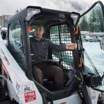 Colter Boehm, service manager for Bobcat of Juneau, works in his company&rsquo;s yard on Friday, Feb. 23, 2018. (Michael Penn | Juneau Empire)