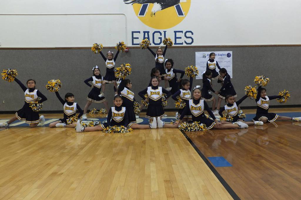 The Angoon Eagles cheerleaders finish their routines in formation, with pyramids. Shown are Makia Silva, Lisa K. Booth, Chloe Lane, Nadine Demmert, Jadelyn Endicott, Mary Johnson, Tatum Johnson, Jada Mendenhall, Brenda S. Williams, Klara Endicott, Briana Johnson, Cheyenne Kookesh, Taryn Kookesh, Coral Williams, Halley Washington, Noelle W. Jackson, Shaylianna Kookesh, and Samara Kookesh. Mary Catharine Martin | For the Capital City Weekly