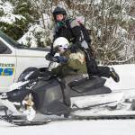 Capital City Fire/Rescue firefighter Blake Fleming and other members of CCFR&rsquo;s rescue team arrive at the Spaulding Meadows snowmachine trail with a man rescued from the John Muir Cabin on Wednesday, Feb. 28, 2018. The man was said to have had a medical issue. Juneau Snowmobile Club members helped in the rescue. (Michael Penn | Juneau Empire)
