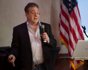 Duff Mitchell, managing director of Juneau Hydropower, speaks to the Juneau Chamber of Commerce at the Hangar Ballroom on Thursday, March 1, 2018. (Michael Penn | Juneau Empire)