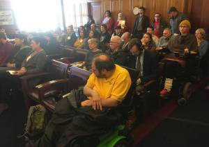 People fill the chairs in the gallery of the House Finance Committee on Friday, March 2, 2018. (James Brooks | Juneau Empire)