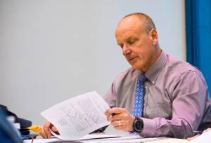Aquatics Board Chair Max Mertz reviews a draft proposal at the Diamond Park Aquatic Center on Tuesday, March 6, 2018. (Richard McGrail | Juneau Empire)