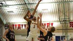 Juneau-Douglas&rsquo; Kolby Hoover attempts to block Ketchikan&rsquo;s Marcus Lee&rsquo;s layup as Erik Kelly, left, Luke Mallinger and Kasey Watts look on Tuesday night in the ASAA Region V 4A tournament. Ketchikan won 58-54. (Nolin Ainsworth | Juneau Empire)