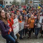 Juneau-Douglas High School students lock arms and shout &ldquo;we want to live&rdquo; during the National School Walk Out in front of the Capitol on Wednesday, March 14, 2018. The students marched from school to the Capitol in support of the 17 victims of the Marjory Stoneman Douglas High School shooting one month ago. (Michael Penn | Juneau Empire)