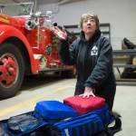 Kathy Miller talks on March 6 about her 10 years as a volunteer firefighter/EMT for Capital City Fire/Rescue at the Lynn Canal Fire Station after a career as a nurse. (Michael Penn | Juneau Empire)