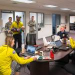 Juneau Mountain Rescue personnel discuss search priorities at the Army National Guard hangar in Juneau while waiting for a weather window to fly. (Courtesy photo | Ben Huff)
