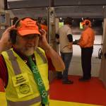 Range officer Bruce Bowler dons his hearing protection before two teams participate in the pistol-shooting competition at the 21st annual Legislative Shoot on Saturday, March 17, 2018 at the Juneau Gun Club. (James Brooks | Juneau Empire)