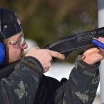A hull flies from the shotgun of Shea Siegert at the 21st annual Legislative Shoot on Saturday, March 17, 2018 at the Juneau Gun Club. (James Brooks | Juneau Empire)