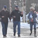 From left to right, Rep. Paul Seaton, R-Homer; Sen. Click Bishop, R-Fairbanks; and Brittany Hartman talk on a foggy morning after finishing the shotgun portion of the 21st annual Legislative Shoot on Saturday, March 17, 2018 at the Juneau Gun Club. (James Brooks | Juneau Empire)