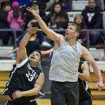 Juneau Crush&rsquo;s Joshua Dean, right, rebounds over Yakutat&rsquo;s Ralph Wolfe during their C bracket game in the Juneau&rsquo;s Lion&rsquo;s Gold Medal Basketball Tournament at Juneau-Douglas High School on Tuesday, March 20, 2018. (Michael Penn | Juneau Empire)