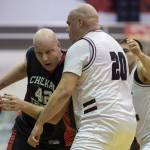 Klukwan&rsquo;s Jeff Sharnbroich, left, drives againt Hoonah&rsquo;s Andy Gray in their Master&rsquo;s bracket game in the Juneau Lion&rsquo;s Gold Medal Basketball Tournament at Juneau-Douglas High School on Thursday, March 22, 2018.