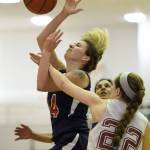 Haines&rsquo; Samantha Clay, right, fouls Yakutat&rsquo;s Justyne Wheeler in the first half of the Juneau Lion&rsquo;s Gold Medal Basketball Tournament Women&rsquo;s Bracket championship game at Juneau-Douglas High School on Saturday, March 24, 2018. (Michael Penn | Juneau Empire)