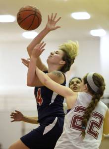 Haines&rsquo; Samantha Clay, right, fouls Yakutat&rsquo;s Justyne Wheeler in the first half of the Juneau Lion&rsquo;s Gold Medal Basketball Tournament Women&rsquo;s Bracket championship game at Juneau-Douglas High School on Saturday, March 24, 2018. (Michael Penn | Juneau Empire)