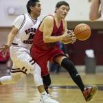 Kake&rsquo;s Rich Austin tightly guards Hoonah&rsquo;s Albert Hinchman in the Master&rsquo;s bracket of the the Juneau Lion&rsquo;s Gold Medal Basketball Tournament at Juneau-Douglas High School on Monday, March 19, 2018. (Michael Penn | Juneau Empire)